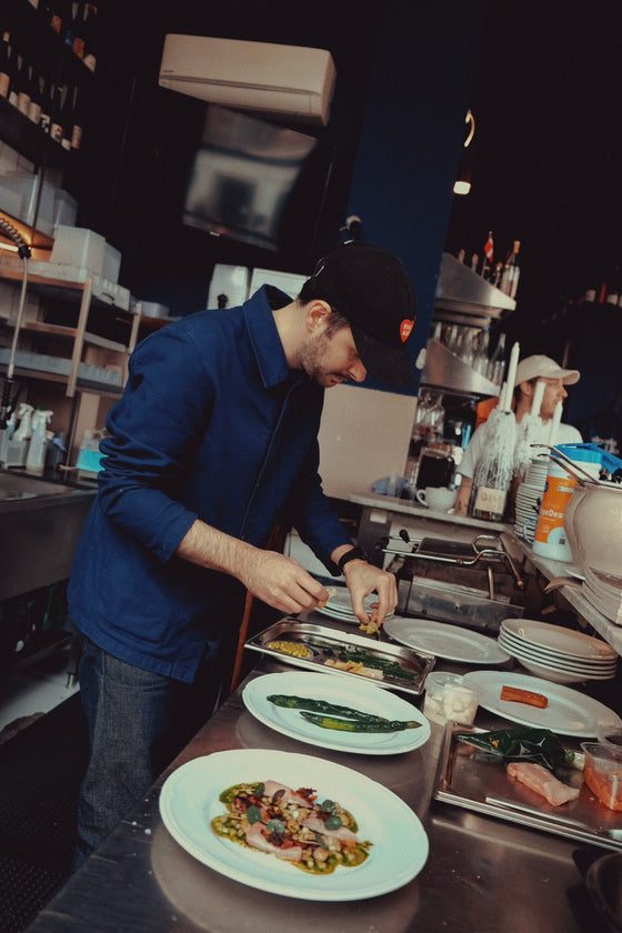 The chef plating at Vinoria Lilo