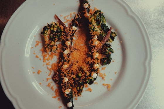 A plated fish course at Vinoria Lilo